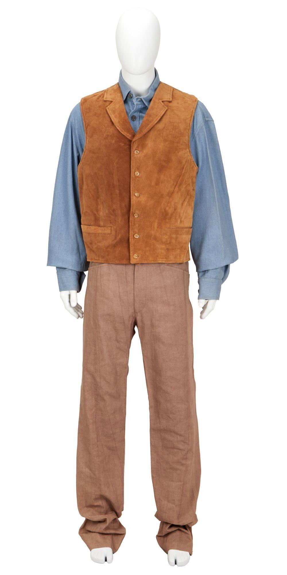 a mannequin wearing a brown vest and brown pants