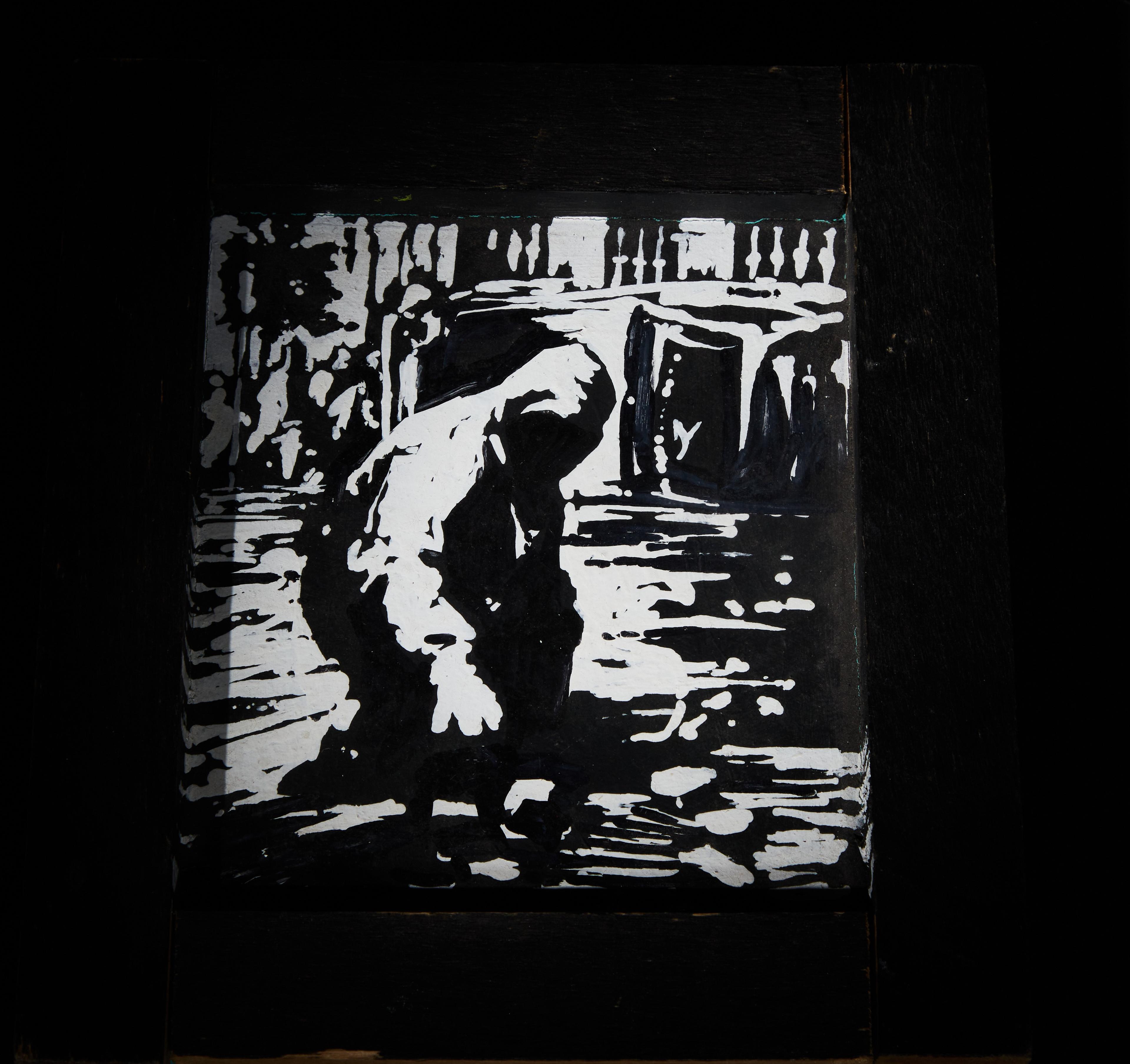 a black and white painting of a man bending over in the water .