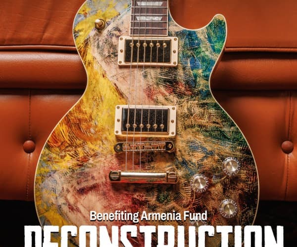A poster for Julien's Auctions featuring a guitar