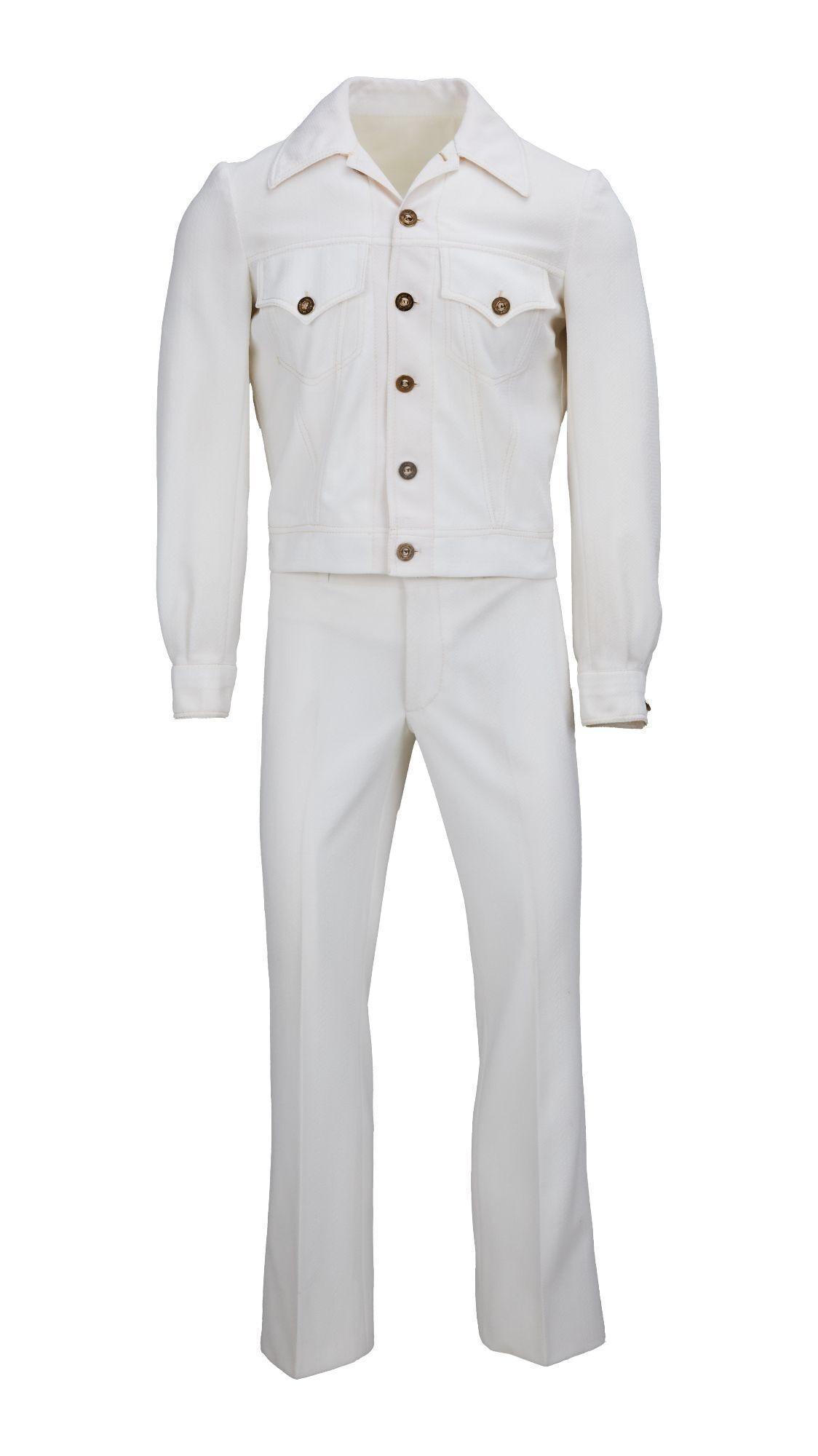 Lot #41. Sonny Bono | The Sonny And Cher Show Two-Piece Off-White Ensemble a white suit with brown buttons is on a mannequin