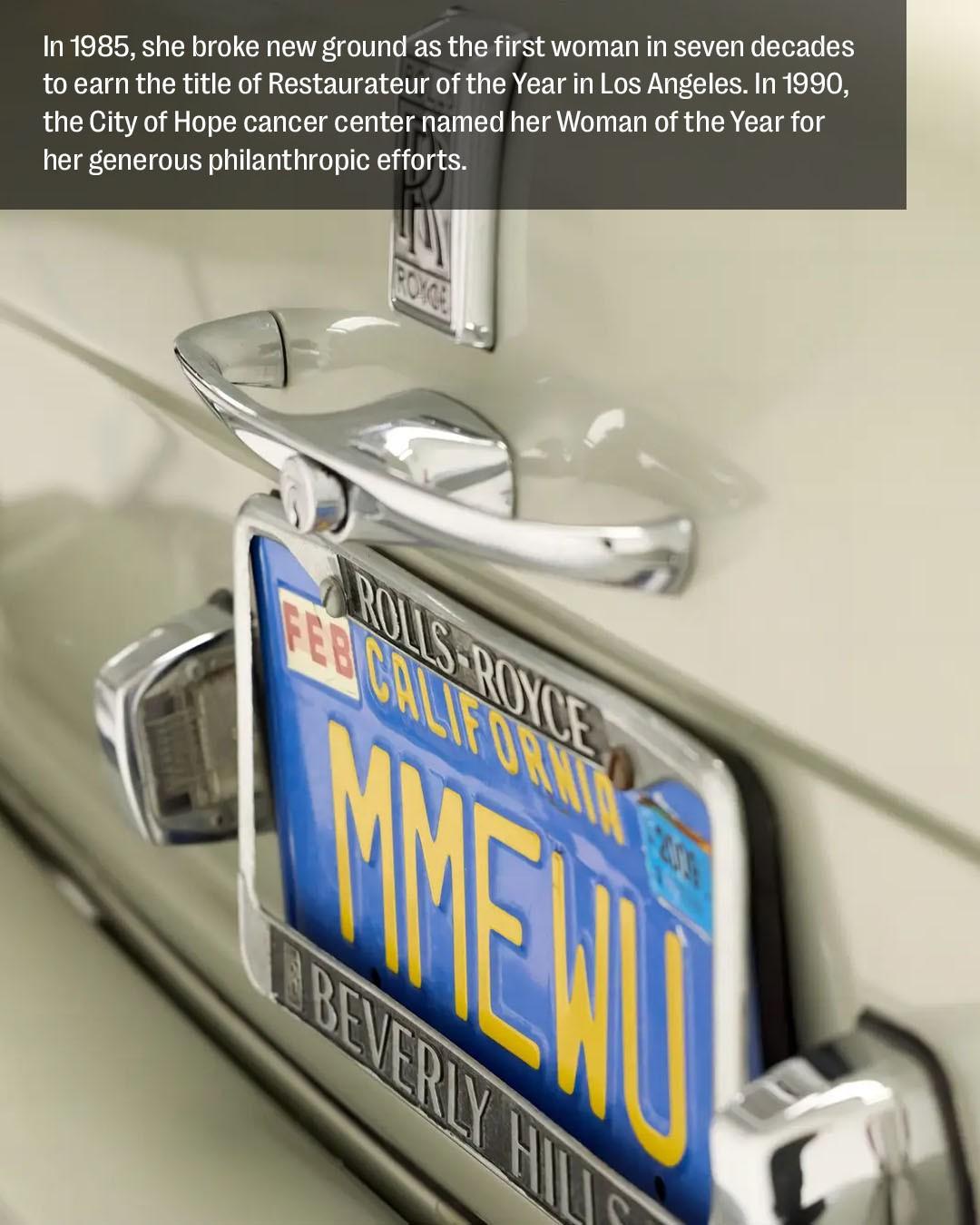 the blue and yellow license plate of madame wu's rolls royce which reads m m e w u