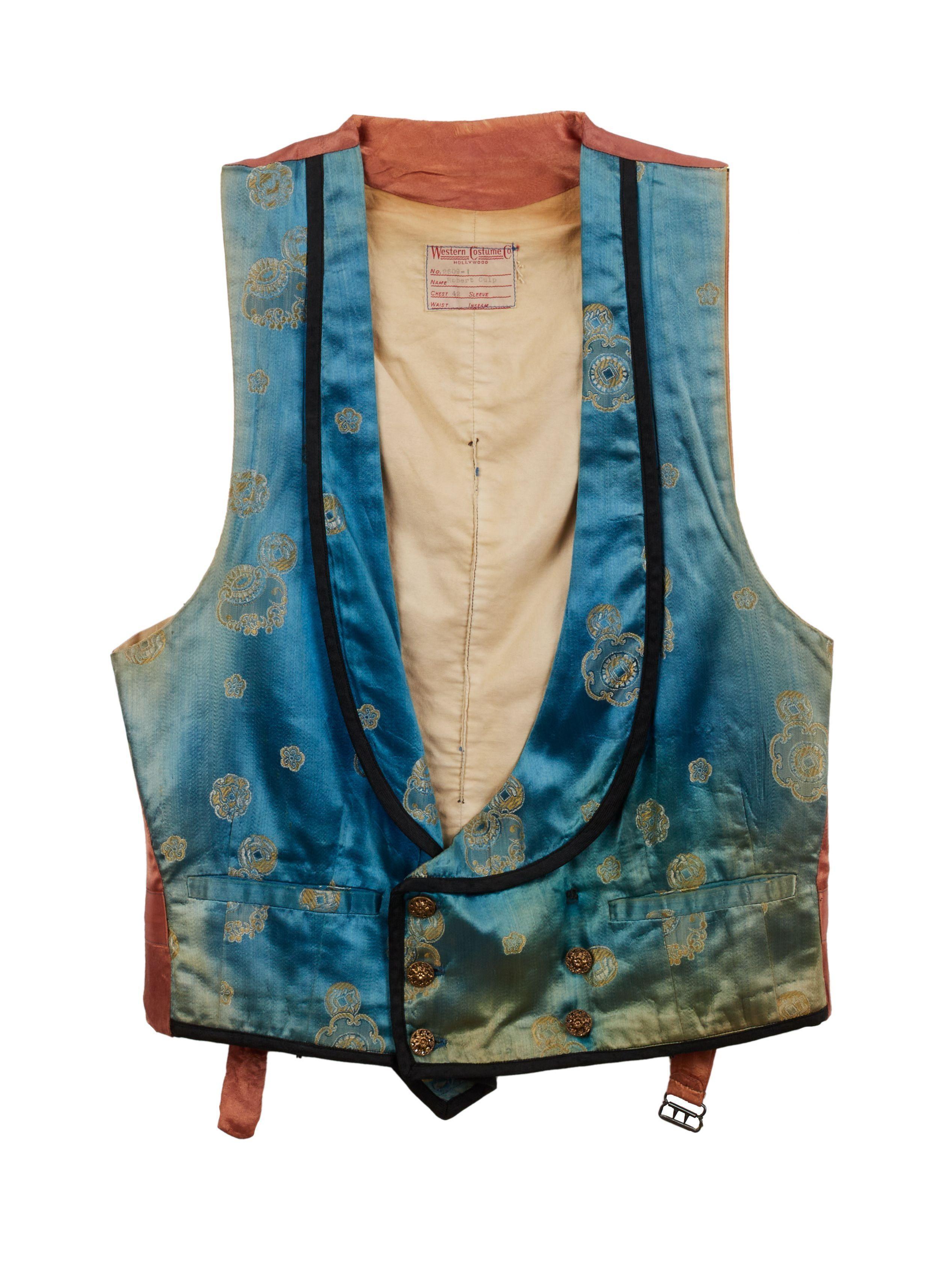 a teal, green, and copper western vest