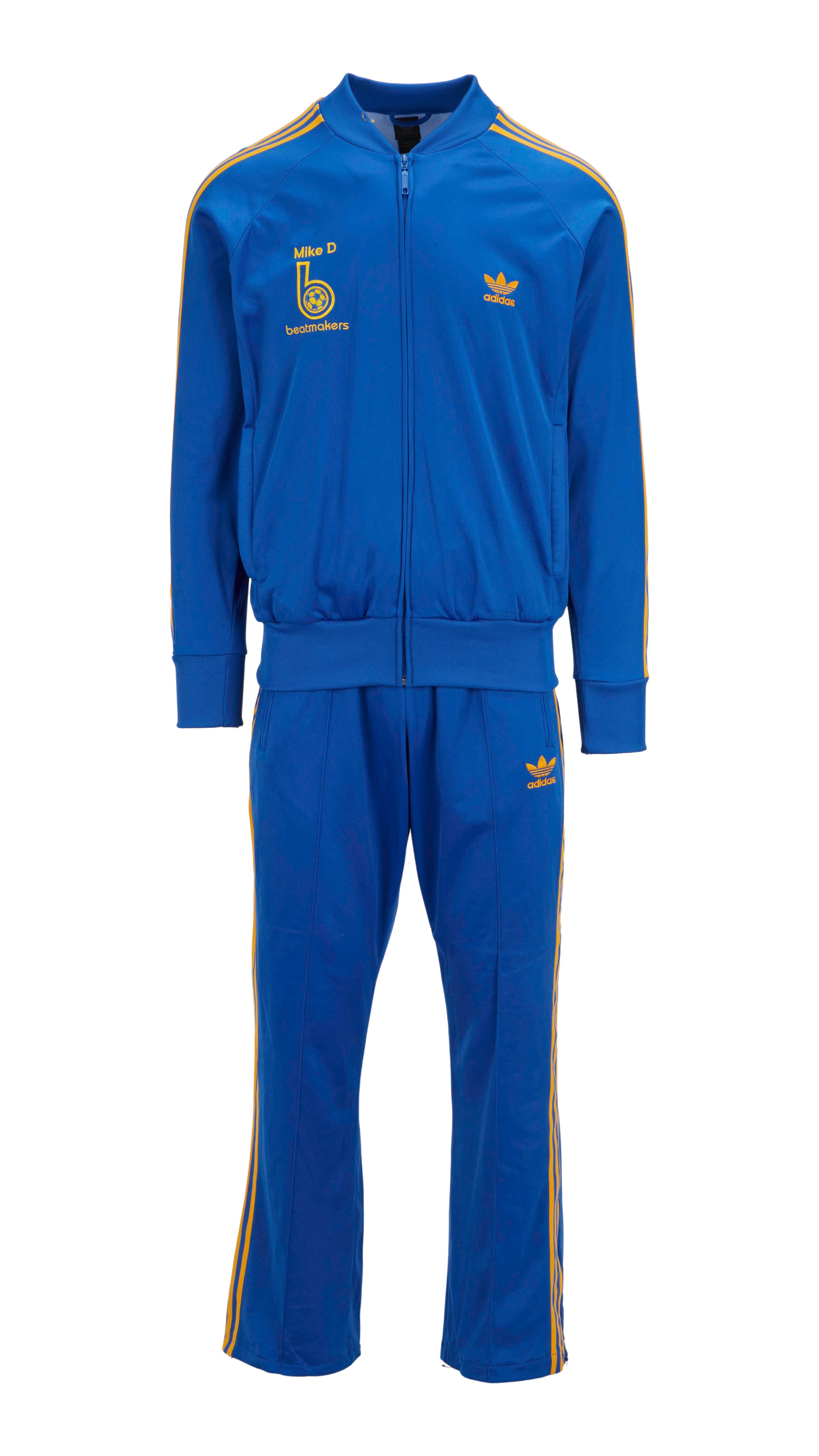 a blue adidas tracksuit with mike d written on the front