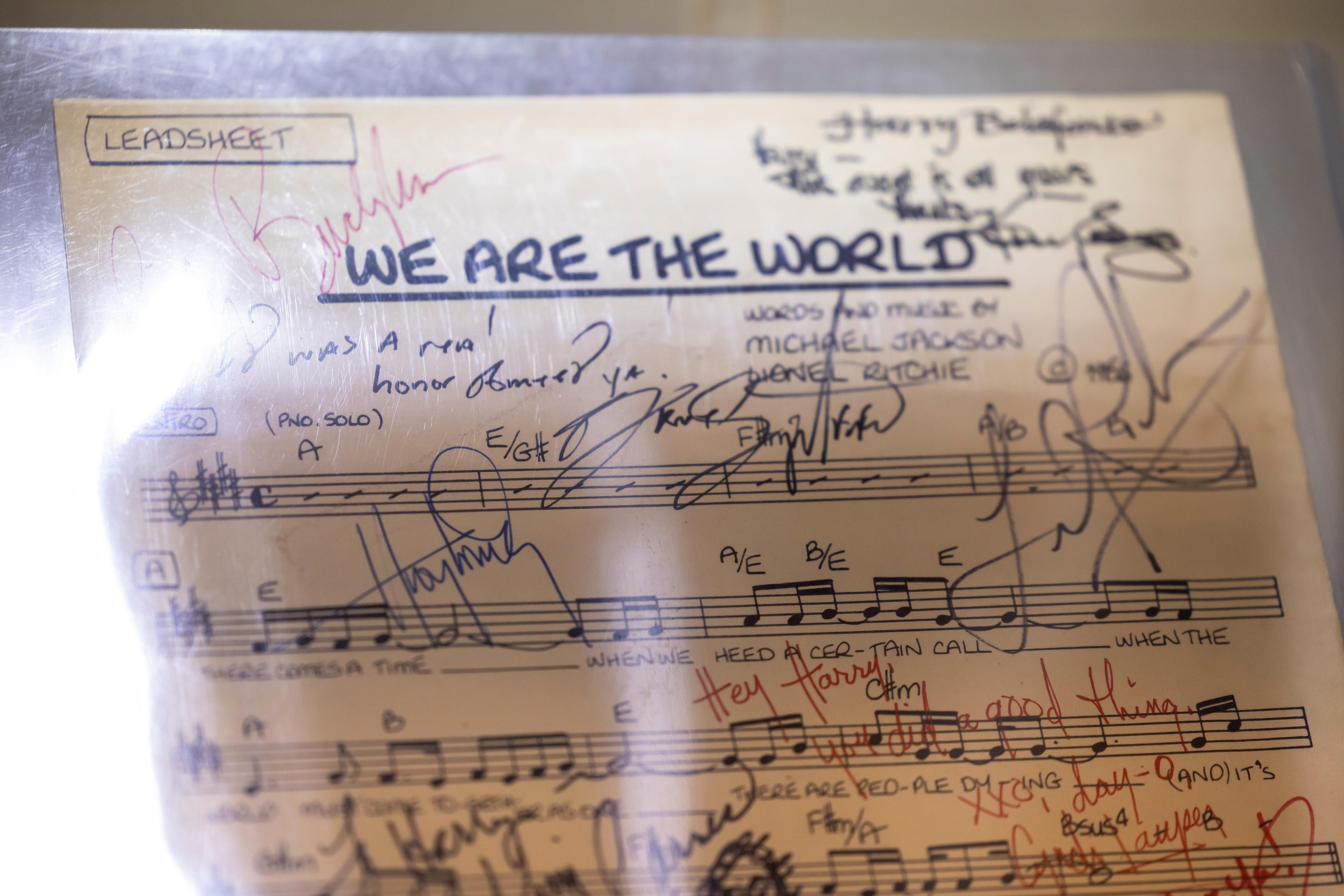 a close up of a sheet of music with signatures on it .
