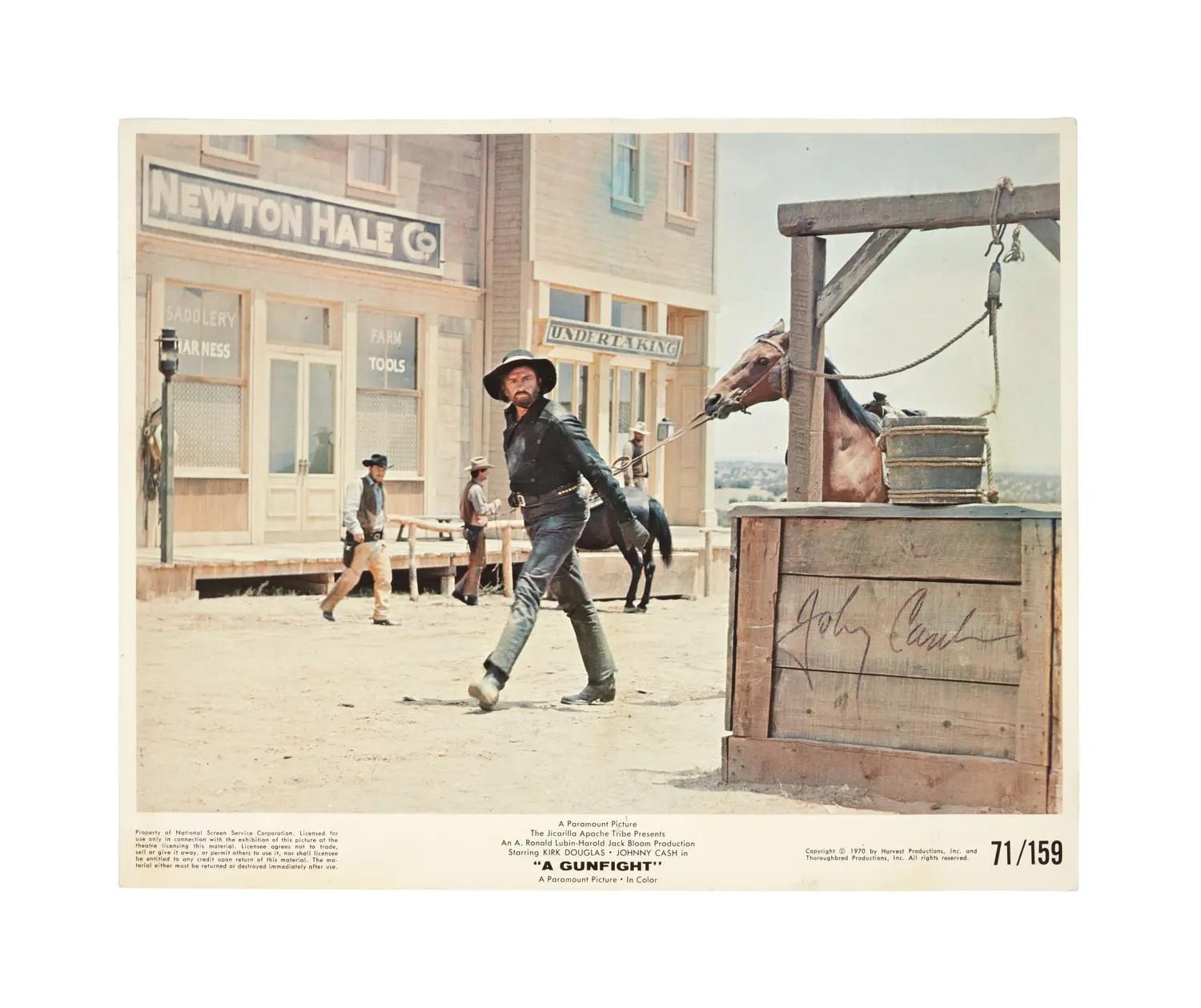 Lot 23  Johnny Cash Signed Color Still from A Gunfight