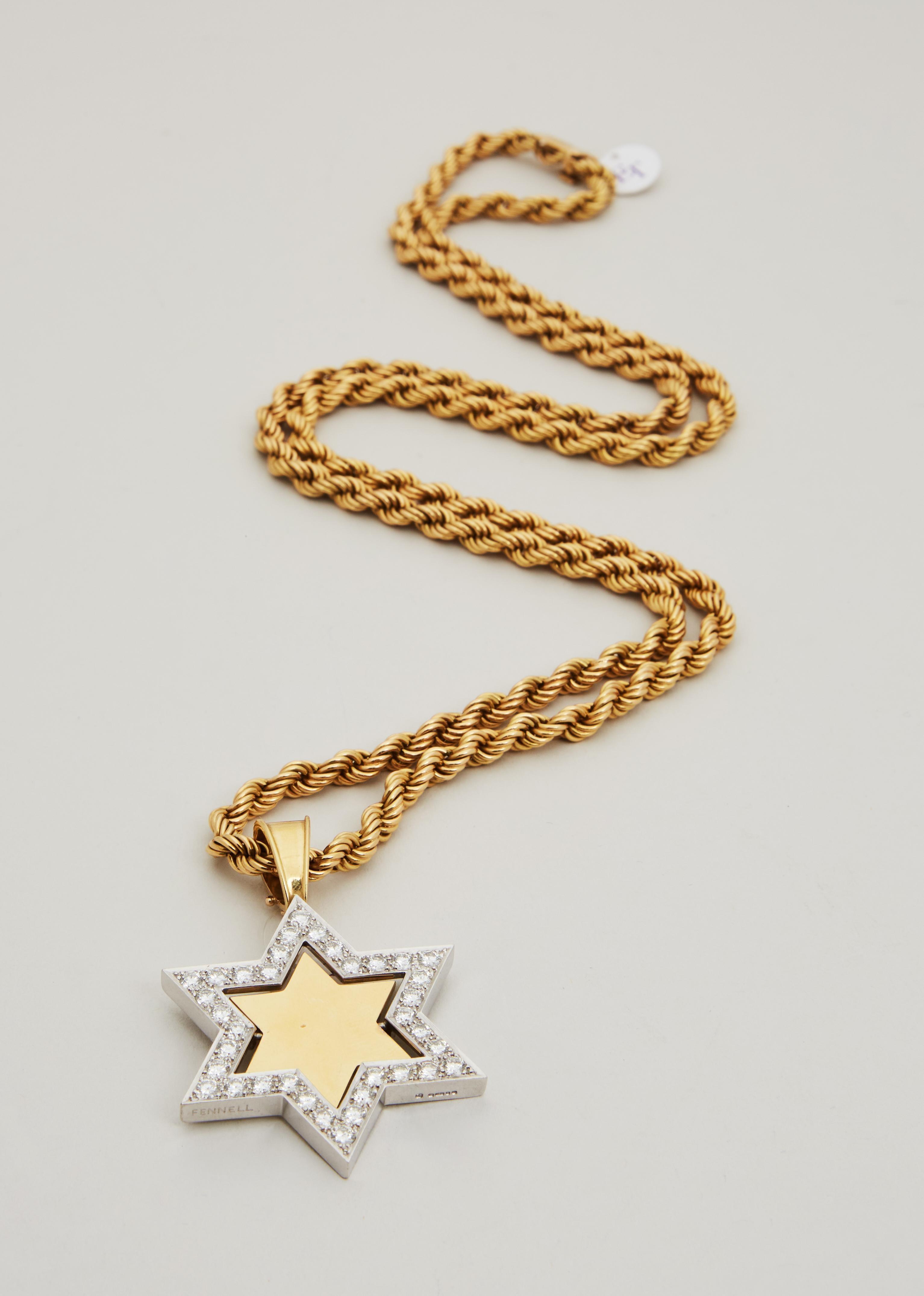 Lot #34. Elizabeth Taylor | Theo Fennell Diamond and Gold Star of David Pendant a gold chain with a star shaped pendant on it