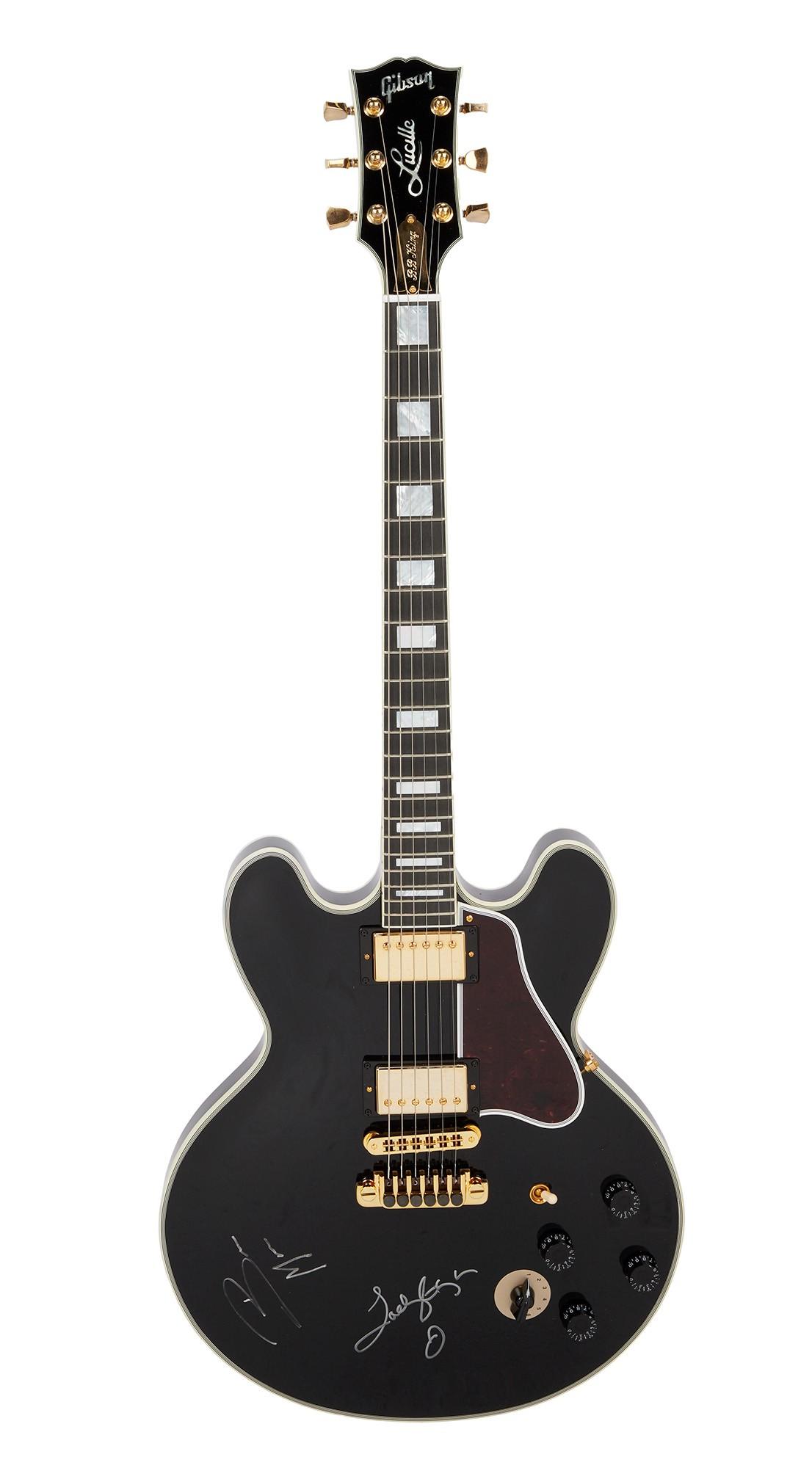 Lady Gaga and Bruno Mars | Signed Gibson B.B. King Lucille Semi-Hollowbody Electric Guitar, Black Black Gibson B.B. King Lucille electric guitar with gold hardware and multiple signatures on the body.