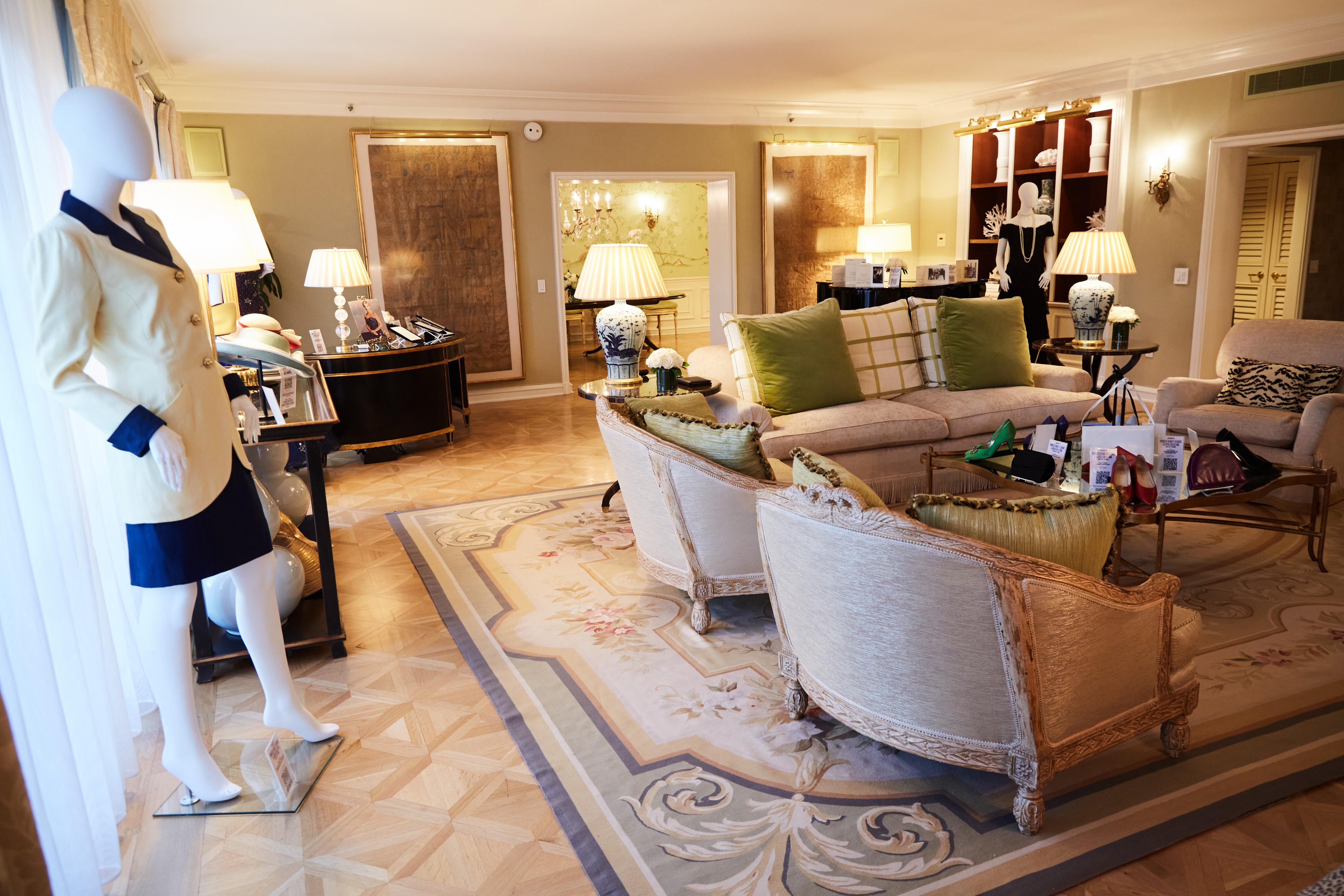 a living room filled with furniture and a mannequin .