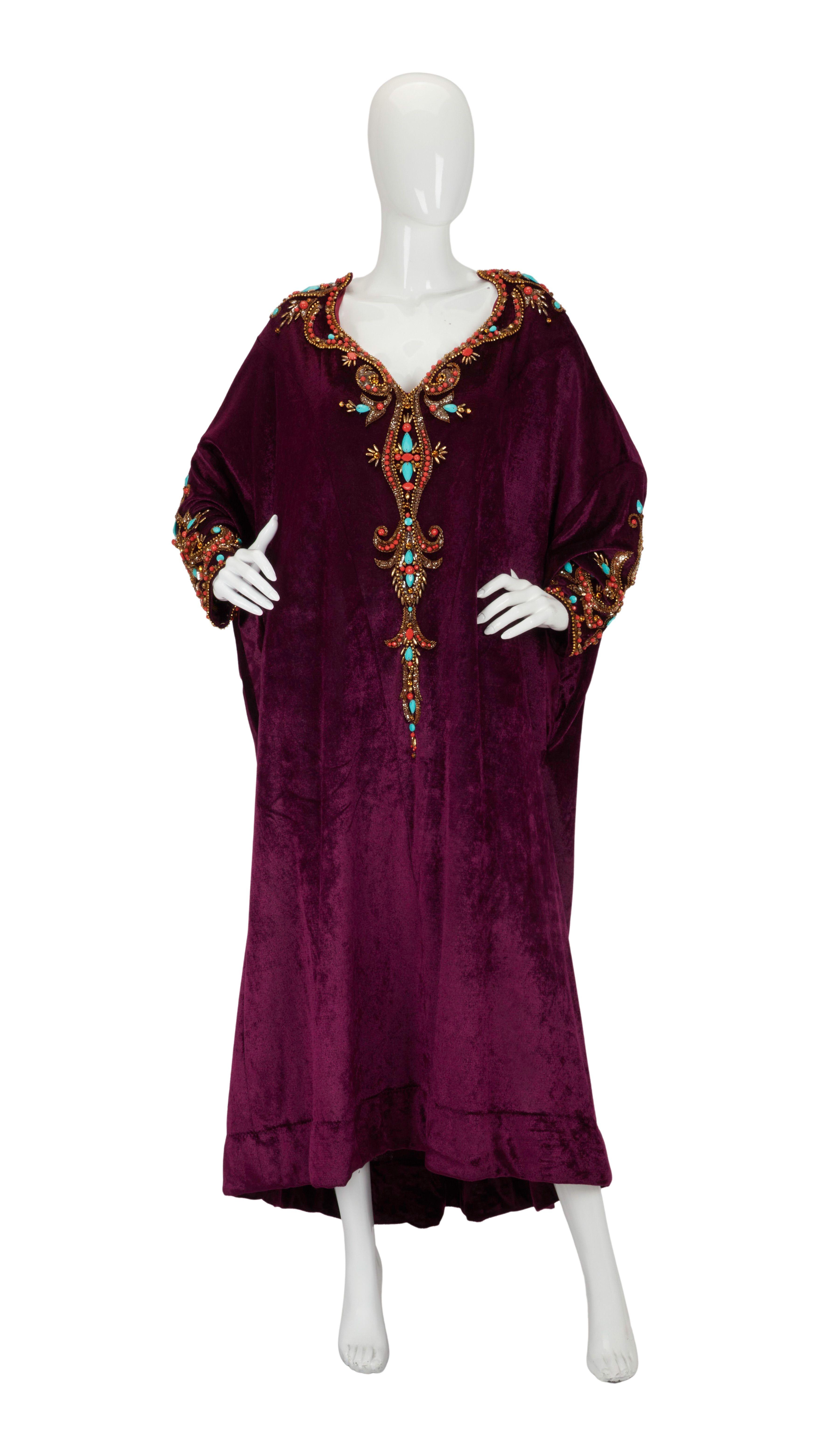 Lot #221. Mama Cass Elliot | 1970 Photo-Worn Bob Mackie Caftan with Photo a purple robe