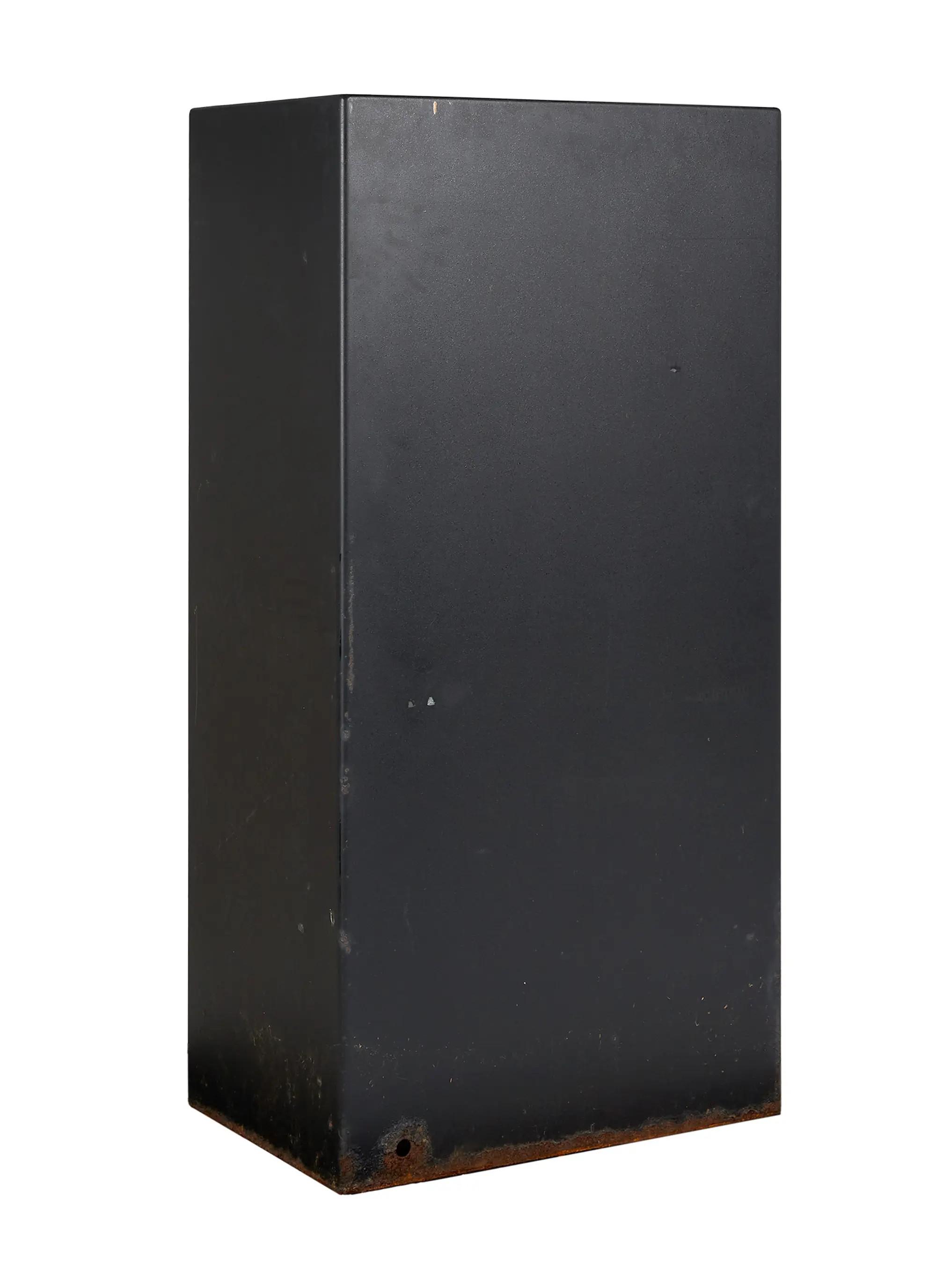 a photo of the back of a black safe