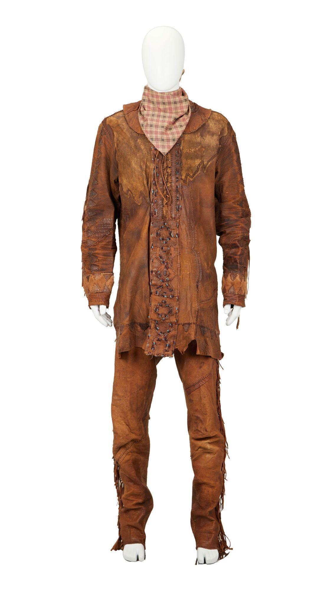 a mannequin wearing a brown leather jacket and pants
