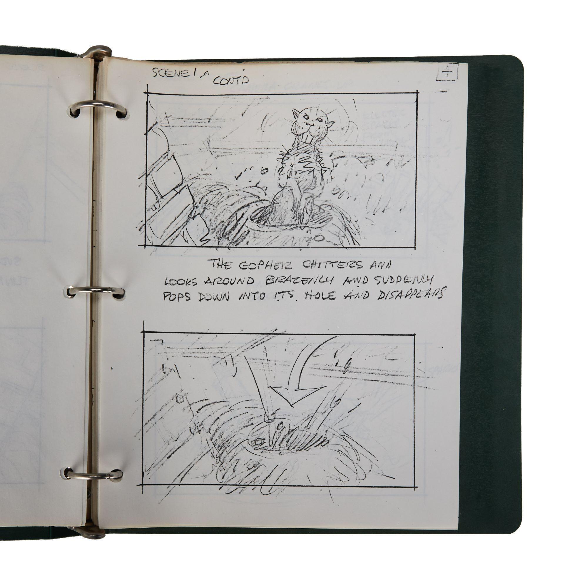 a book is open to a page with a drawing of a cat on it .