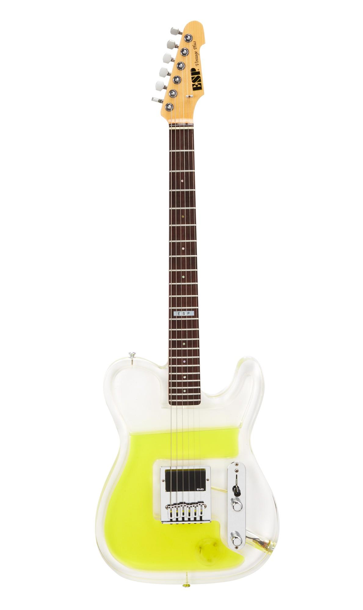 a clear translucent bass guitar with yellow liquid on the inside of the hollow body