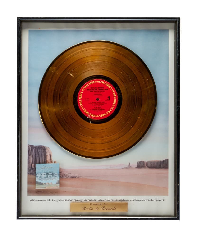 a gold record in a frame that says radio & records