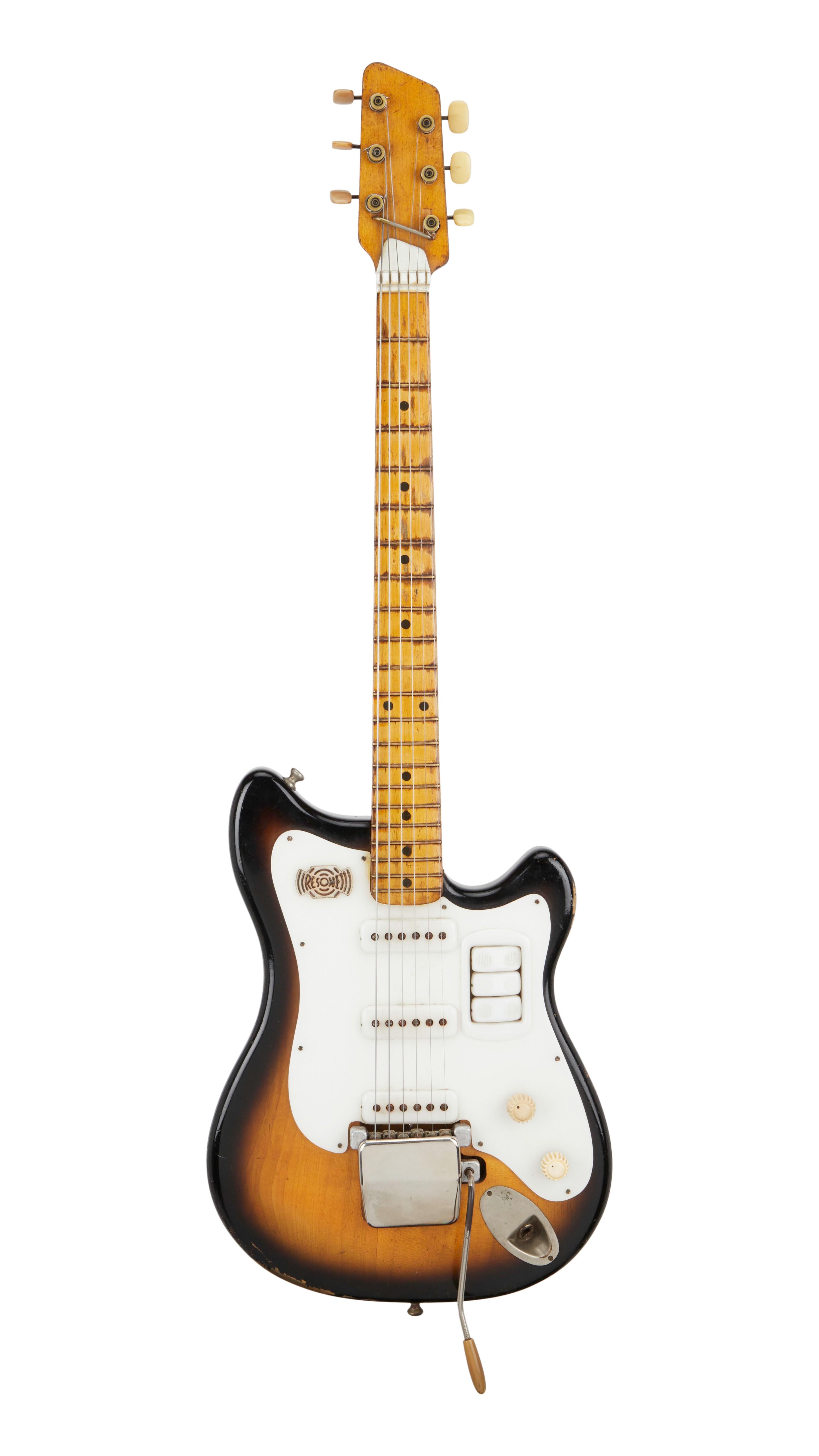 a brown and white electric guitar on a white background