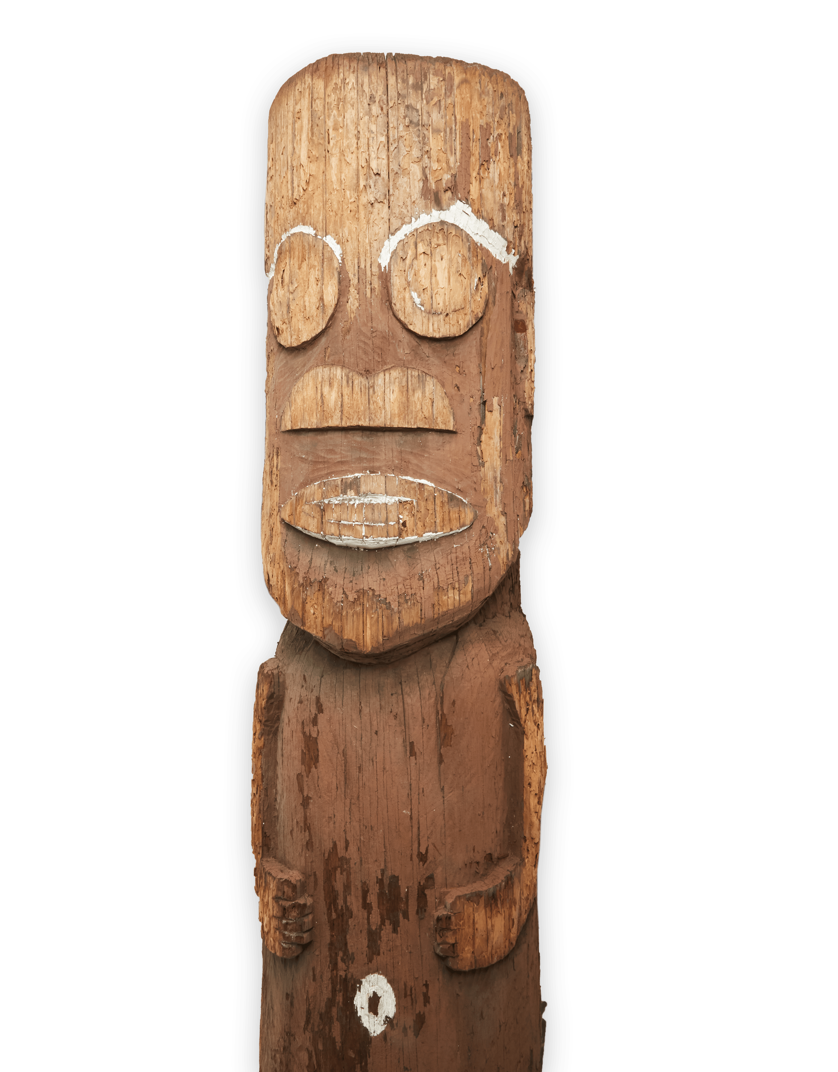 a wooden totem pole with a face carved into it