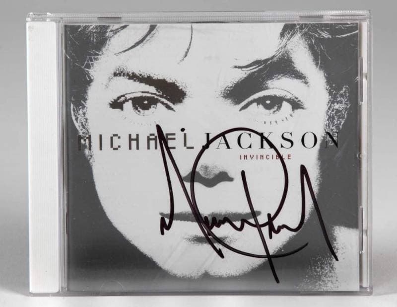 MICHAEL JACKSON SIGNED INVINCIBLE COMPACT DISC